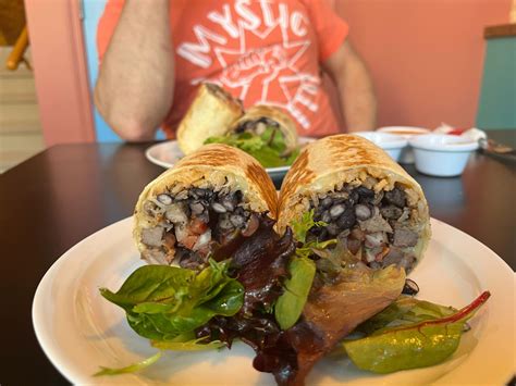 Mystic burrito - Order Kalua Pig Burrito online from Mystic Burrito 3133 Eastern Avenue. Pork braised in banana leaves, Spanish rice, Monterey jack cheese, Maui onion rings, island slaw & Japanese BBQ sauce